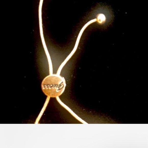 Gold Guess bracelet with pearl and lock charms - Picture 3 of 3